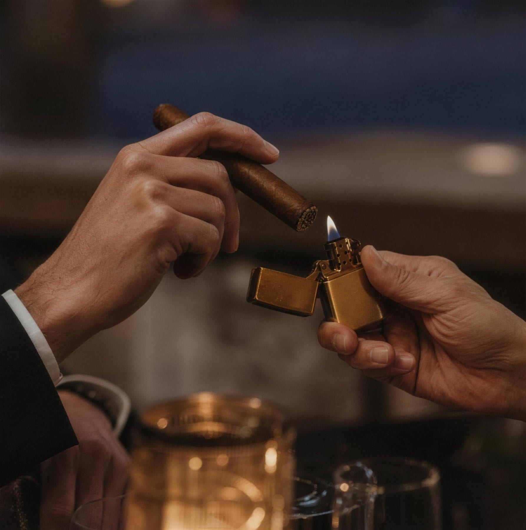 A cigar being lit at the table
